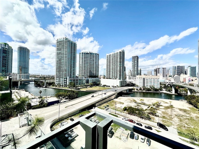 property's view of city featuring a water view