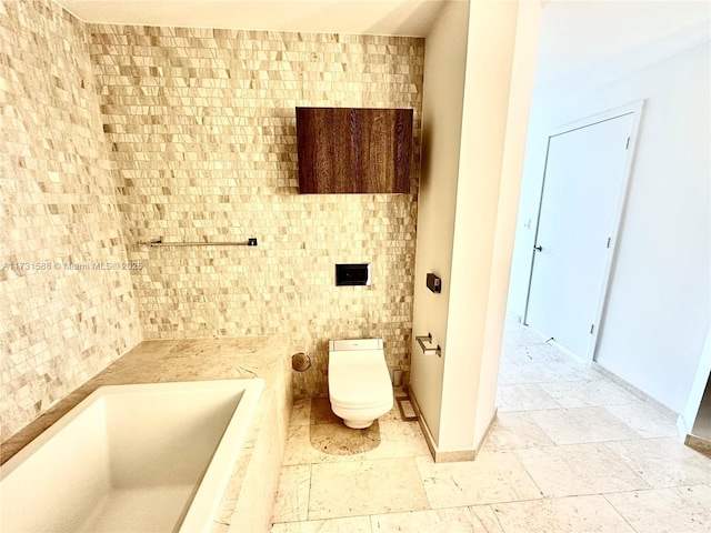 bathroom featuring toilet and a bathing tub