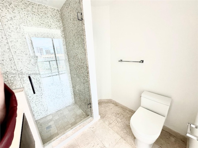 bathroom with walk in shower and toilet