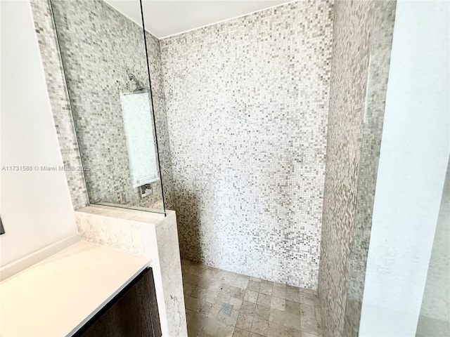 bathroom with a tile shower