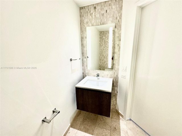 bathroom with vanity and tile walls