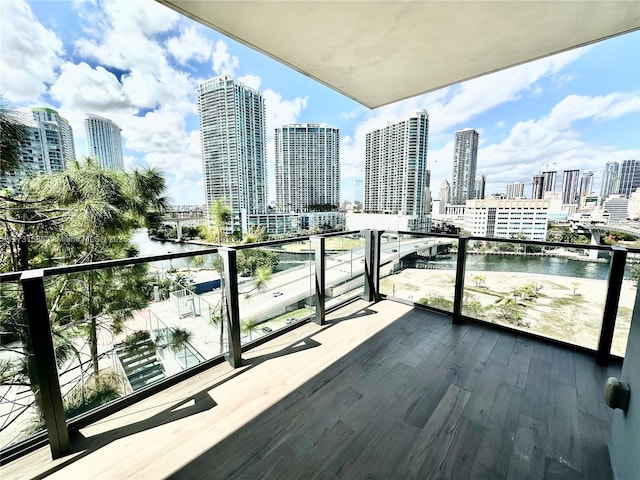 balcony featuring a water view