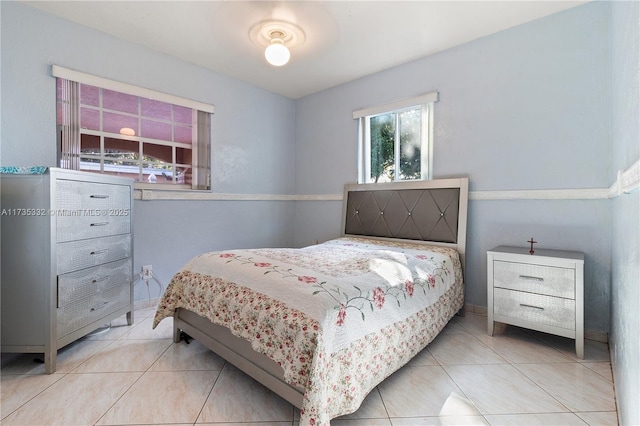 bedroom featuring light tile patterned flooring