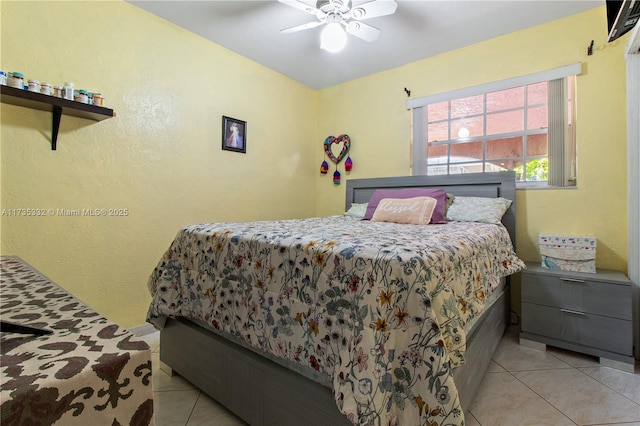 tiled bedroom with ceiling fan