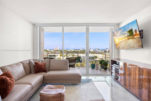 tiled living room featuring a wealth of natural light and expansive windows