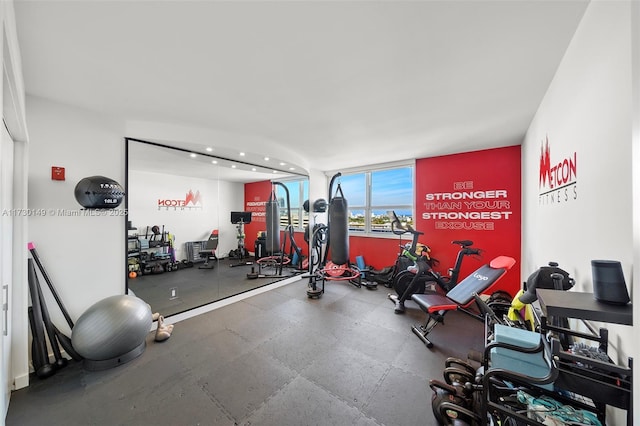 workout area featuring expansive windows