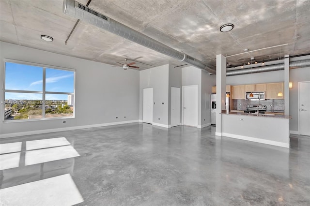 interior space featuring ceiling fan and stainless steel fridge with ice dispenser