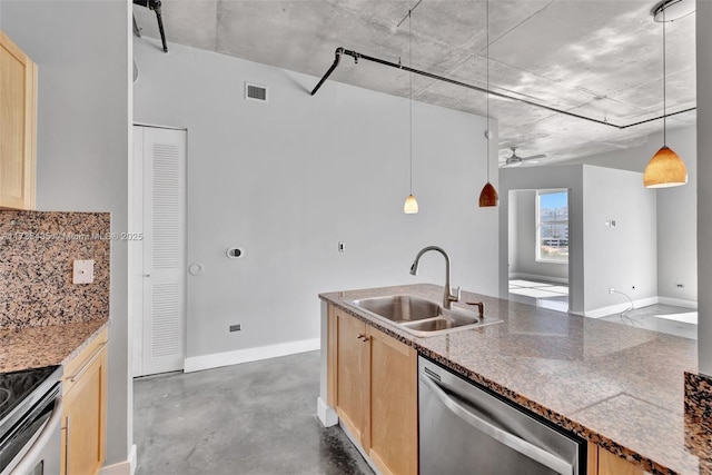 kitchen featuring light brown cabinetry, sink, decorative light fixtures, appliances with stainless steel finishes, and backsplash