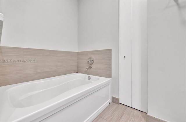 bathroom featuring a tub to relax in