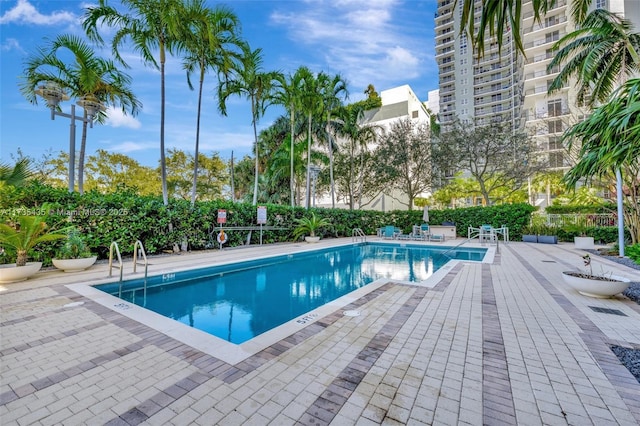 view of swimming pool with a patio area