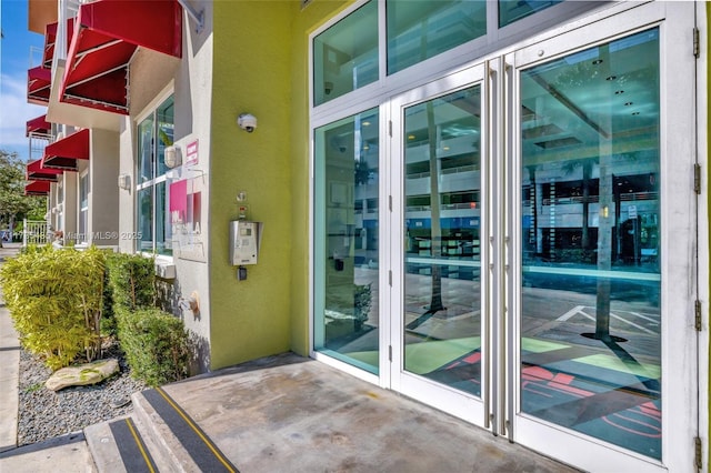 view of exterior entry featuring french doors