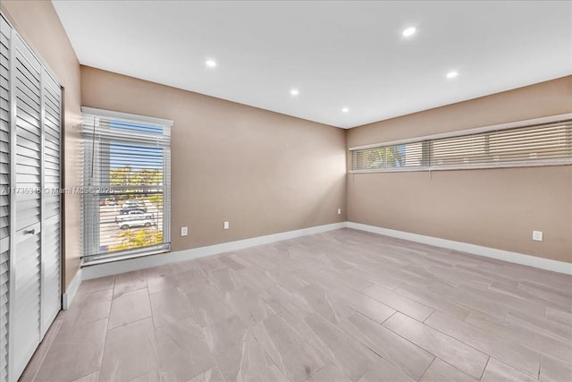 spare room featuring plenty of natural light