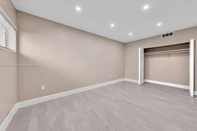 unfurnished bedroom with a closet