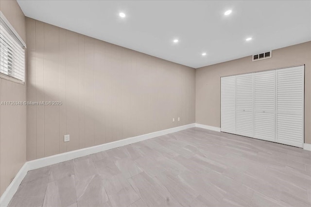 unfurnished bedroom with a closet