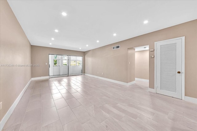 spare room featuring light tile patterned floors