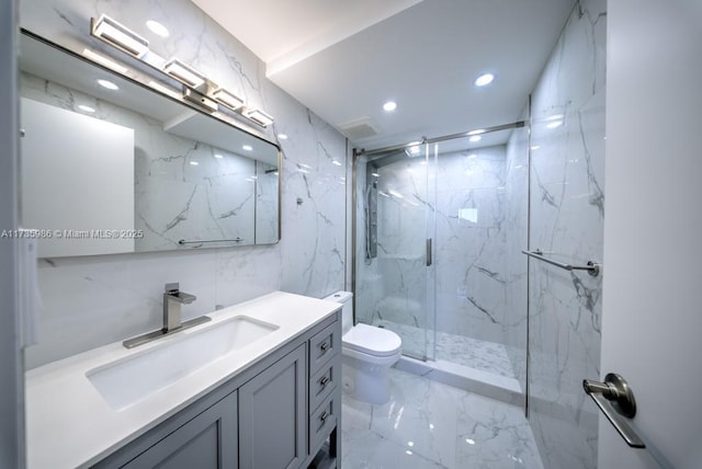 bathroom featuring vanity, toilet, and a shower with door