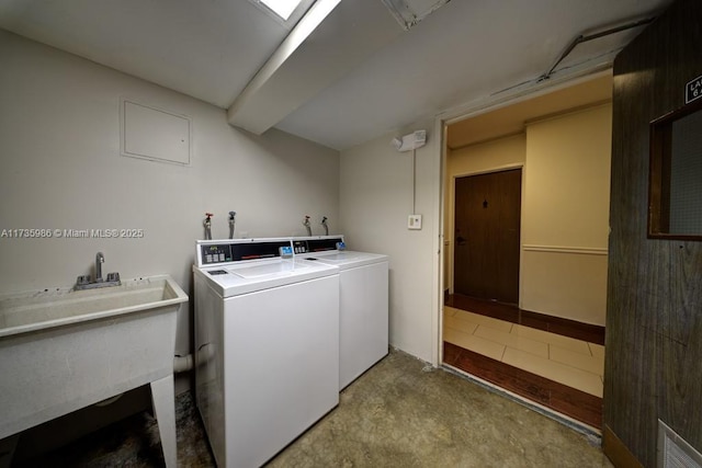 laundry room featuring sink and washing machine and clothes dryer