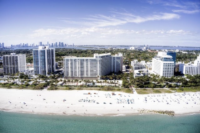 aerial view featuring a view of the beach and a water view