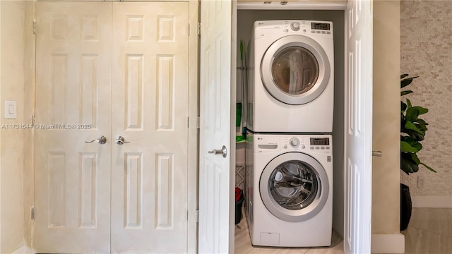 laundry room featuring laundry area and stacked washing maching and dryer