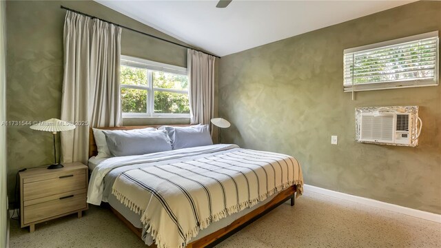 bedroom with multiple windows and ceiling fan