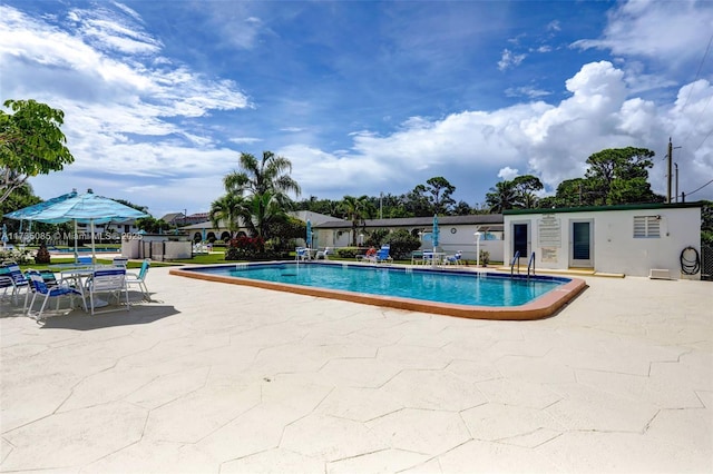 view of swimming pool featuring a patio