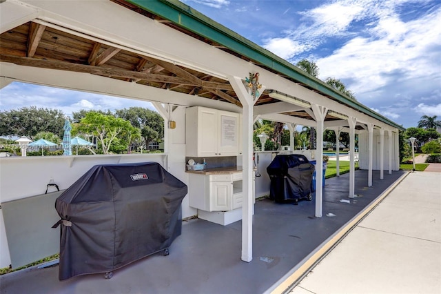 view of patio with a grill