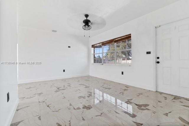 16025 NW 29th Ave, Miami Gardens, FL 33054 - spare room featuring marble finish floor, baseboards, and a ceiling fan