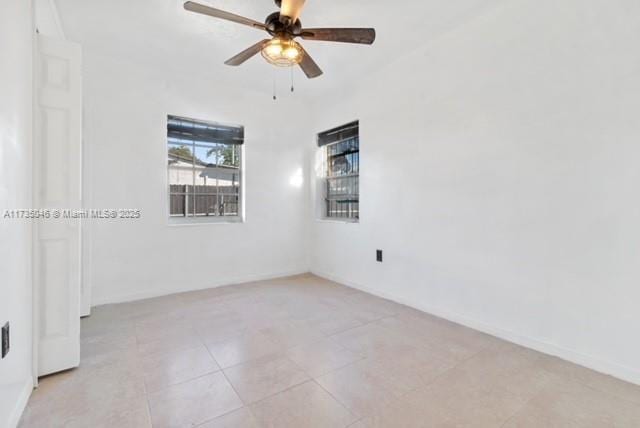 16025 NW 29th Ave, Miami Gardens, FL 33054 - empty room featuring ceiling fan and light tile patterned floors