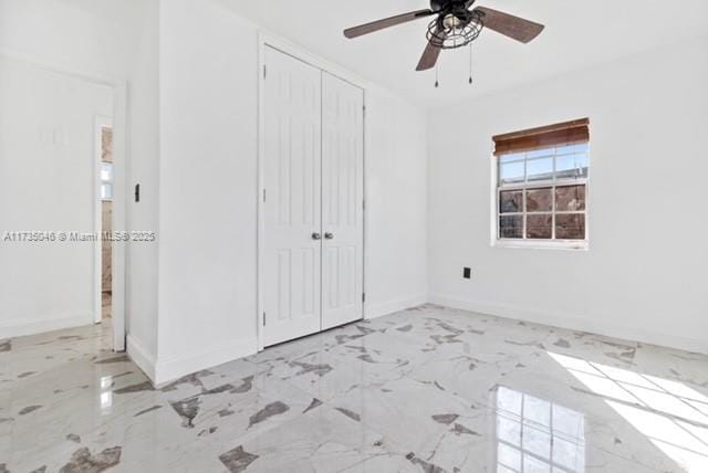 unfurnished bedroom with a closet and ceiling fan