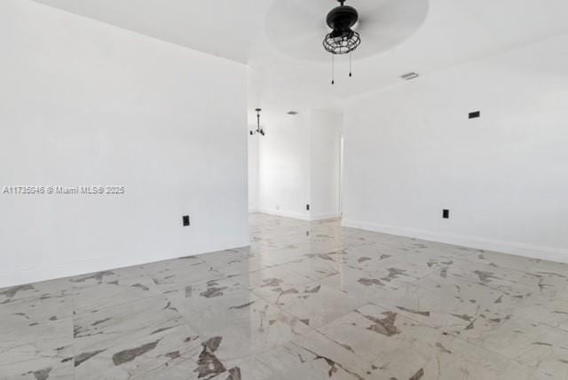 empty room featuring ceiling fan