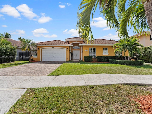 15804 SW 99th Ter, Miami, FL 33196 - mediterranean / spanish home featuring stucco siding, driveway, an attached garage, and a tiled roof
