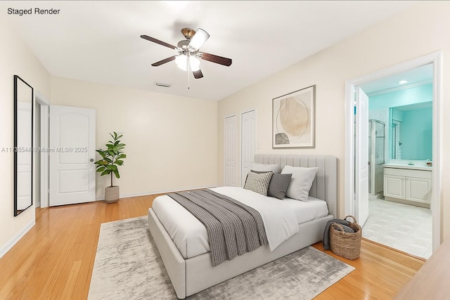 15804 SW 99th Ter, Miami, FL 33196 - bedroom with light wood-style floors, connected bathroom, and a ceiling fan
