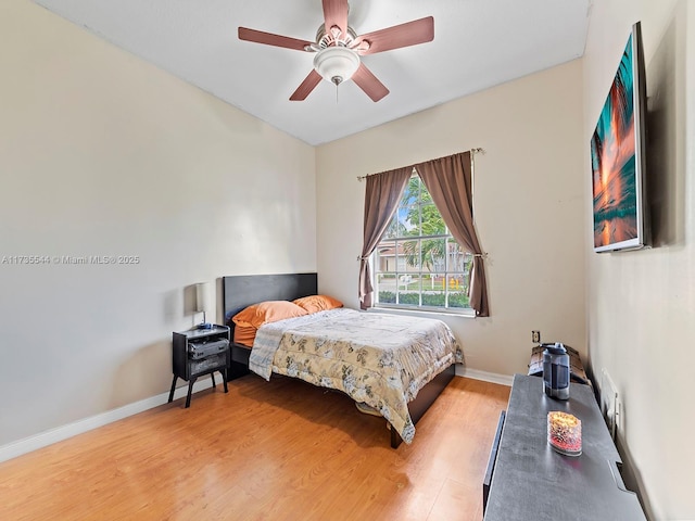 15804 SW 99th Ter, Miami, FL 33196 - bedroom with light wood-type flooring, baseboards, and ceiling fan