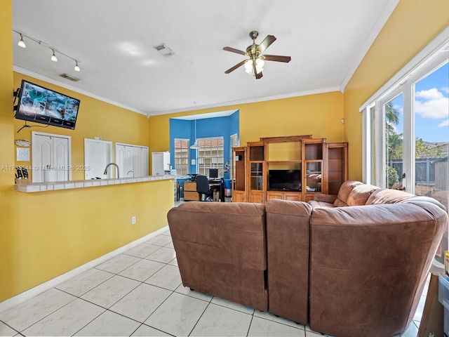 15804 SW 99th Ter, Miami, FL 33196 - living area with crown molding, a ceiling fan, light tile patterned floors, and baseboards