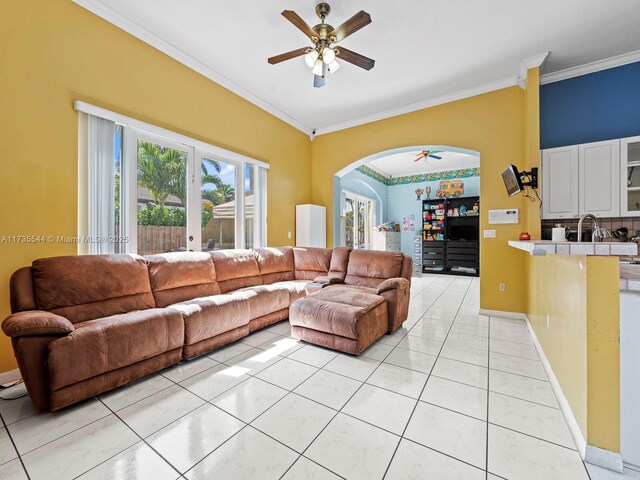 15804 SW 99th Ter, Miami, FL 33196 - living area with a ceiling fan, crown molding, arched walkways, and light tile patterned floors