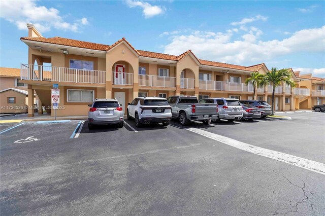 7011 W 29th Ave Unit 210, Hialeah, FL 33018 - view of building exterior featuring uncovered parking
