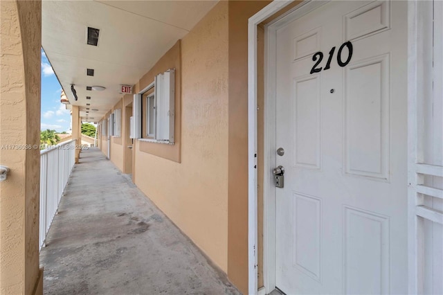 7011 W 29th Ave Unit 210, Hialeah, FL 33018 - doorway to property featuring stucco siding