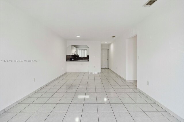 7011 W 29th Ave Unit 210, Hialeah, FL 33018 - unfurnished living room featuring recessed lighting and light tile patterned floors