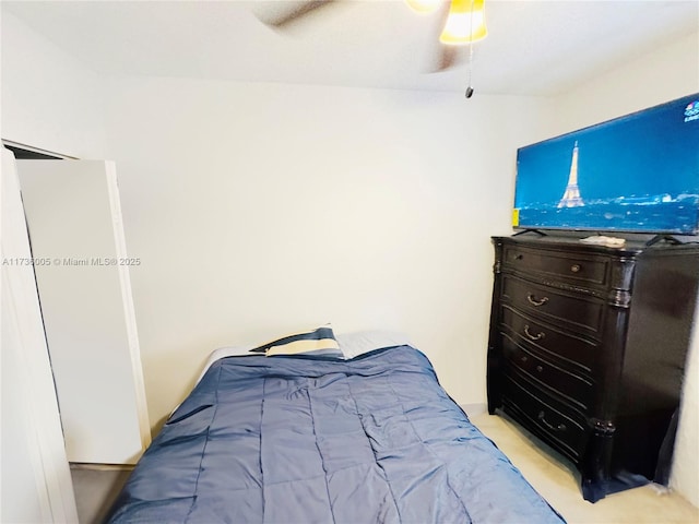 bedroom featuring ceiling fan and light colored carpet