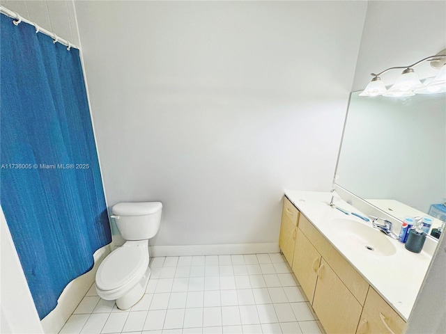 bathroom featuring tile patterned flooring, vanity, a shower with shower curtain, and toilet