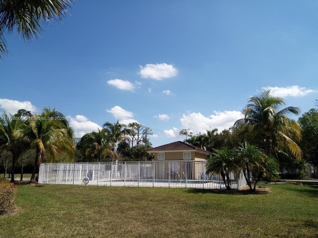 view of pool featuring a yard