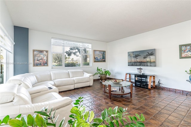 living room featuring a healthy amount of sunlight and a textured ceiling