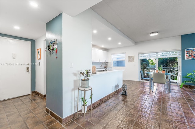 kitchen with white cabinetry and sink