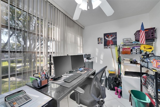 tiled office featuring ceiling fan