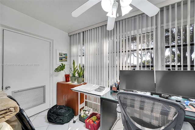 tiled office featuring ceiling fan