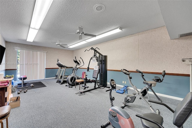 workout room with a textured ceiling