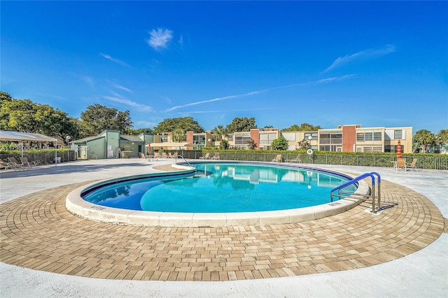 view of pool featuring a patio area