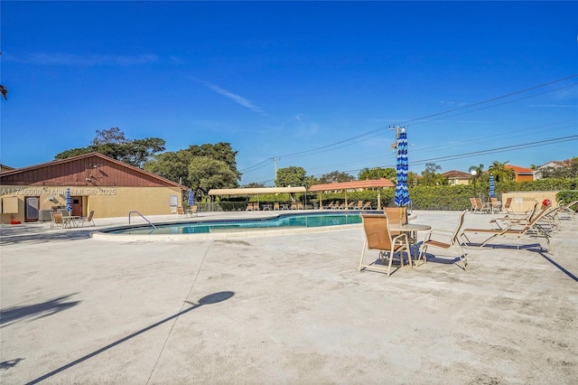 view of swimming pool featuring a patio area