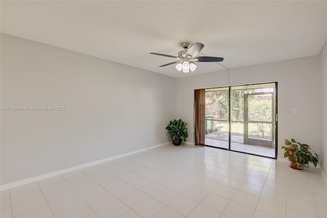 spare room with ceiling fan and a textured ceiling