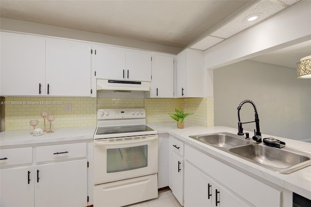 kitchen with light tile patterned flooring, tasteful backsplash, sink, white cabinets, and electric stove